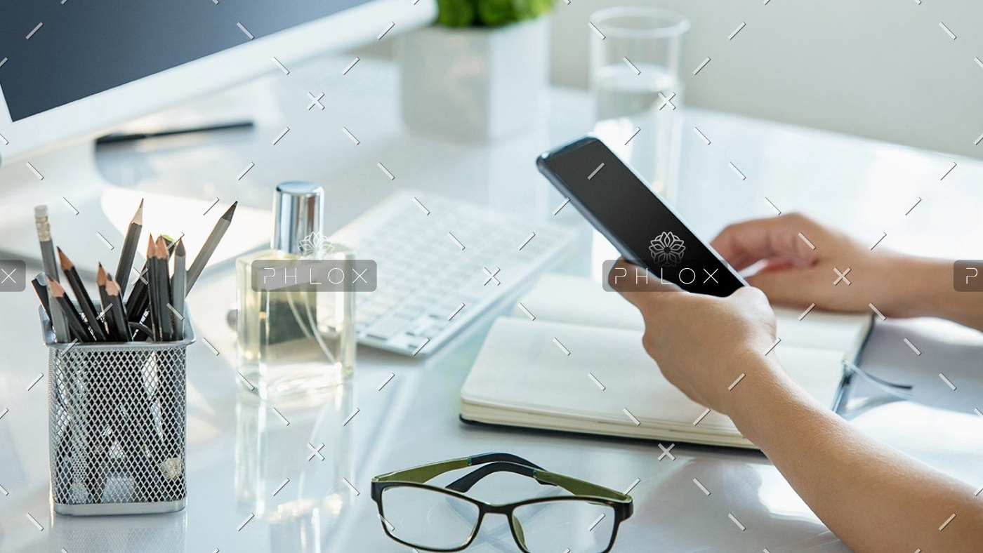 demo-attachment-399-close-up-of-female-hands-using-smart-phone-while-PWQR3QP