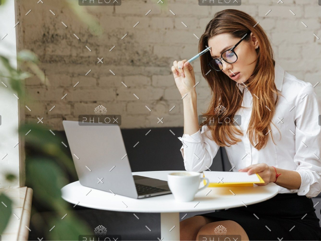 demo-attachment-407-thoughtful-business-woman-indoors-using-laptop-P5HYUQX